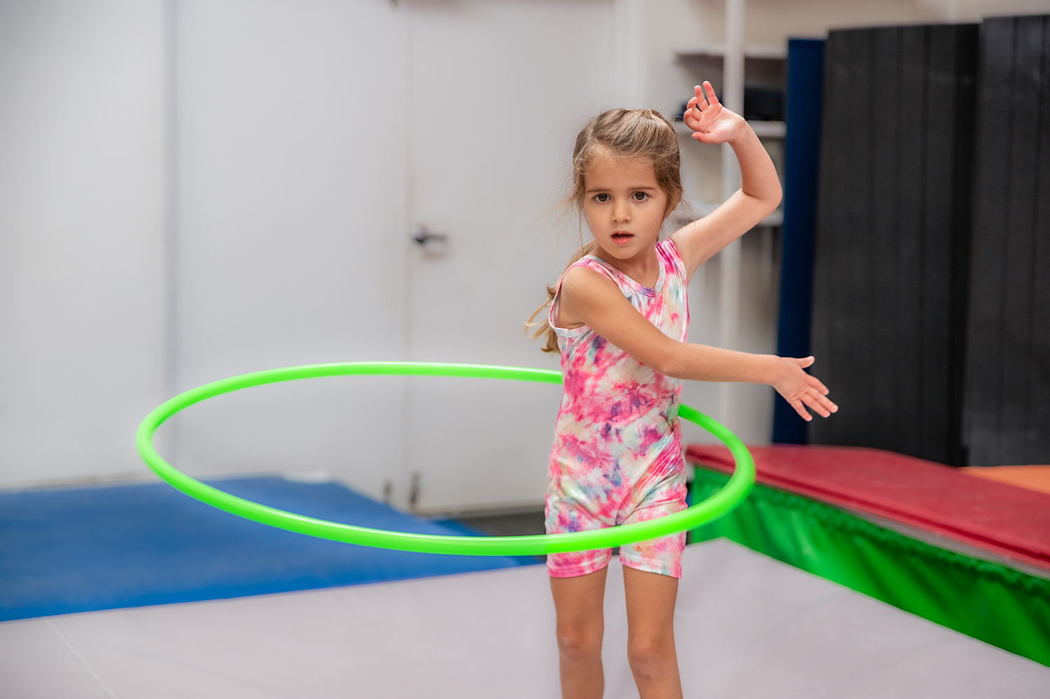 A young girl practices the hula hoop at a Harpeth Gymnastics camp.